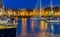 The port of Vlissingen at night, decorated ships with lights, lighted city buildings with water, popular city in zeeland, The