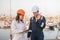 Port workers with clipboard and radio