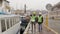 Port workers in helmets talking near the boat