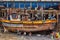 Port workers repair a fishing boat in the fishing port of Panama City.