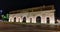 Porta Nuova stone defense gate at night in Verona, Italy.