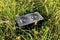 Portable audio speaker in the grass