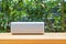 Portable Bluetooth wireless music speaker on wooden table