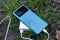 Portable charger charges a smartphone in nature. Power Bank on a journey to charge gadgets.