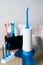 Portable oral irrigator kit in bathroom, waterpik for family use