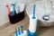 Portable oral irrigator kit in bathroom, waterpik for family use