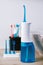 Portable oral irrigator kit in bathroom, waterpik for family use