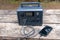 Portable Power Generator Charging a Smartphone