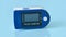 Portable Pulse oximeter isolated on blue background