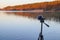 Portable recorder stands on a tripod on the lake shore