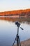Portable recorder stands on a tripod on the lake shore