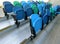 Portable rows of stadium plastic chairs.