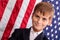 Portait of Caucasian boy with American flag