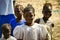 Portait of child african people who are very poor in Senegal. At school in the bush