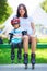 Portait of cute baby boy and his mom wearing inline skates