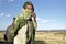 Portait of Ethiopian woman in dry rural landscape