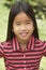 Portait Of Smiling Young Girl Outdoors