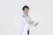 Portait of young Asian happy and smile male medical doctor with stethoscope in white coat standing in white background