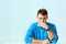 Portait of a young laughing businessman in blue shirt