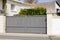 Portal aluminum sliding brown grey metal gate of modern gray beige suburb house entrance