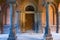 Portal with columns with wooden door on background. Side entry in Church of Three Saints. Architecture University of Chernivtsi, B