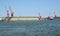 Portal cranes and floating ship dock from the sea. Kaliningrad region