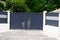 Portal dark grey steel metal gate gray of home suburb street access house garden