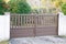 Portal door residential brown brown home suburb metal aluminum house gate street wall