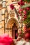 Portal entrance of the Monastery of Batalha in pink oleander flowers in the foreground - Nerium oleander, Batalha