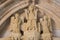 Portal entrance to medieval church on Camino de Santiago, Spain. Three saint statues at cathedral facade. Pilgrimage concept.