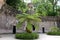 Portal of guardians and treelike fern in Quinta da Regaleira in Sintra