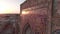 Portal of mosque in the rays of the setting sun, drone aerial