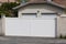 Portal suburb steel metal gate white fence of home suburb street access house garden