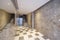 Portal of an urban residential housing building with marble walls,
