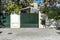 Portal of an urban single-family house with a metal fence painted gray