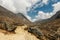 Porter and Sherpa walking with big bag baggage luggage in Himalaya Mountains in Nepal