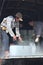 Porters are shaving ice at the local seaport of Con Dao island of Vietnam