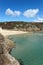 Porthcurno beach and turquoise sea.