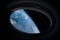 Porthole of spaceship in the outer space, bull\\\'s-eye window from spacecraft. Elements of this image furnished by NASA