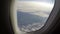 Porthole view turbulence aircraft in clouds, passenger view look