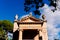 A portico with columns and a triangular pediment on the Greek-style facade of a temple