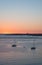 Portimao city view at sunset. Boats in the bay in a summer day.