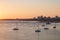 Portimao city view at sunset. Boats in the bay in a summer day.