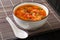 Portion of Asian tomato egg soup close-up in a bowl. horizontal