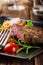 Portion of beef steak served with roast potatoes