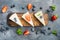 Portion of cheesecake with berries, on gray background, top view flat lay