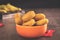 Portion of chicken nuggets for home delivery in an orange jar with a black background