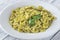 Portion of farfalle with pesto
