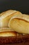 Portion of french bread on black background