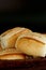 Portion of french bread on black background